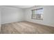Well-lit bedroom with neutral carpeting and window that provides ample natural light at 926 Hawthorn Ln, Grayson, GA 30017