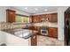 Gourmet kitchen with granite countertops, backsplash and stainless-steel appliances at 926 Hawthorn Ln, Grayson, GA 30017