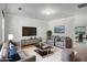 Bright living room with modern furnishings and neutral color scheme at 926 Hawthorn Ln, Grayson, GA 30017