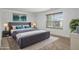 Spacious main bedroom with a plush bed, neutral colors, and large window at 926 Hawthorn Ln, Grayson, GA 30017