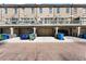 Townhome complex with garages, brick facade, and rear wooden decks at 226 Chastain Preserve Ne Ln, Atlanta, GA 30342