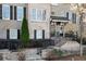 Charming brick townhome with black shutters and manicured landscaping for a welcoming curb appeal at 226 Chastain Preserve Ne Ln, Atlanta, GA 30342