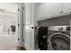 Convenient laundry room with modern machines and ample storage space at 226 Chastain Preserve Ne Ln, Atlanta, GA 30342