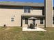 Enjoy this backyard with a concrete patio, outdoor furniture, and a well-maintained lawn at 3299 Arbor Oaks Dr, Snellville, GA 30039