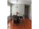 Cozy dining area featuring a modern chandelier and a view of the backyard at 3299 Arbor Oaks Dr, Snellville, GA 30039