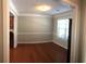 Formal dining room featuring hardwood floors, elegant wainscoting, and ample natural light at 3299 Arbor Oaks Dr, Snellville, GA 30039