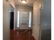 Bright foyer featuring hardwood floors, a white front door with sidelights, and a convenient coat closet at 3299 Arbor Oaks Dr, Snellville, GA 30039