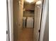 Convenient laundry room with white washer and dryer units and ample storage at 3299 Arbor Oaks Dr, Snellville, GA 30039