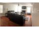 Inviting living room features a ceiling fan, fireplace, hardwood floors, and comfortable furniture at 3299 Arbor Oaks Dr, Snellville, GA 30039