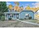 Charming blue single-story home with a cozy front porch and well-kept landscaping at 3918 S Creek Ct, Stone Mountain, GA 30083