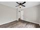 Bedroom with laminate flooring, ceiling fan, and neutral-toned walls at 558 Newlin Ct, Lawrenceville, GA 30046