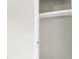 A bright closet with white shelving and a rail to hang clothes on at 558 Newlin Ct, Lawrenceville, GA 30046