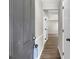 View of the home's entry way, featuring wood-look floors and neutral paint at 558 Newlin Ct, Lawrenceville, GA 30046