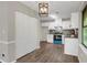 The kitchen is connected to the living room and features sleek appliances and ample cabinet space at 558 Newlin Ct, Lawrenceville, GA 30046