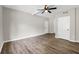 Spacious living room with laminate flooring, ceiling fan, and freshly painted walls at 558 Newlin Ct, Lawrenceville, GA 30046