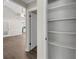 A bright pantry with shelving and luxury vinyl plank flooring at 558 Newlin Ct, Lawrenceville, GA 30046