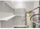 The storage room features laminate flooring, shelving and water heater at 558 Newlin Ct, Lawrenceville, GA 30046