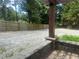 Large backyard with gravel and fence lines, provides ample parking and storage at 1570 Cedars Rd, Lawrenceville, GA 30045