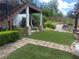 Beautiful backyard featuring lush landscaping, a stone pathway, and manicured lawn at 1570 Cedars Rd, Lawrenceville, GA 30045
