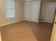 This basement features neutral paint, tiled floors, and white doors, offering a versatile space at 1570 Cedars Rd, Lawrenceville, GA 30045