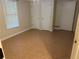 This basement features neutral paint, tiled floors, and white doors, offering a versatile space at 1570 Cedars Rd, Lawrenceville, GA 30045