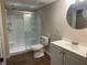 Well-lit bathroom with an updated toilet and shower at 1570 Cedars Rd, Lawrenceville, GA 30045