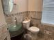 Bathroom features modern fixtures, a glass bowl sink, and tiled accents at 1570 Cedars Rd, Lawrenceville, GA 30045