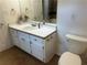Bathroom featuring a vanity with a mirror, toilet, and tiled floor at 1570 Cedars Rd, Lawrenceville, GA 30045