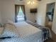 Bedroom featuring a wall-mounted TV, and access to the kitchen at 1570 Cedars Rd, Lawrenceville, GA 30045