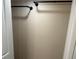 Interior view of a closet with black bars for hanging clothing at 1570 Cedars Rd, Lawrenceville, GA 30045
