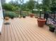 Expansive outdoor deck with black railings offers ample space for lounging and potted plants at 1570 Cedars Rd, Lawrenceville, GA 30045