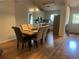 Dining area featuring hardwood floors and an open-concept design to the kitchen and living area at 1570 Cedars Rd, Lawrenceville, GA 30045