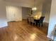 Spacious dining room with hardwood floors and a dining table with upholstered chairs at 1570 Cedars Rd, Lawrenceville, GA 30045