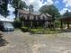 Charming two-story home features a spacious balcony and well-manicured front yard at 1570 Cedars Rd, Lawrenceville, GA 30045