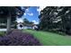 Lovely single-story home surrounded by mature trees and vibrant landscaping, offering serene curb appeal at 1570 Cedars Rd, Lawrenceville, GA 30045