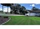 Well-maintained single-story home with lush green lawn and a convenient driveway with basketball hoop at 1570 Cedars Rd, Lawrenceville, GA 30045
