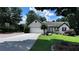 Charming single-story home with a lush green lawn and an inviting driveway with basketball hoop at 1570 Cedars Rd, Lawrenceville, GA 30045