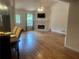 Bright living room with a cozy fireplace, neutral walls, and hardwood floors at 1570 Cedars Rd, Lawrenceville, GA 30045