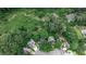 Stunning aerial view of homes near lush greenery, a creek, and pond, offering a serene and private setting at 3747 Sturbridge Ct, Tucker, GA 30084
