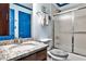 Bathroom featuring a granite countertop, wooden cabinet, and shower with a sliding door at 3747 Sturbridge Ct, Tucker, GA 30084