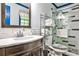 Updated bathroom features white marble countertops, dark wood cabinets, and a tiled shower at 3747 Sturbridge Ct, Tucker, GA 30084