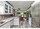 Well-designed kitchen open to the dining area, featuring stainless steel appliances and ample counter space at 3747 Sturbridge Ct, Tucker, GA 30084