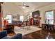 Inviting living room featuring a fireplace, hardwood floors, and comfortable seating at 3747 Sturbridge Ct, Tucker, GA 30084