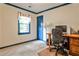 Office with neutral carpet, cream walls, blue trim, and a wooden desk at 3747 Sturbridge Ct, Tucker, GA 30084