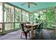 Relaxing screened porch with comfortable seating and views of the surrounding greenery at 3747 Sturbridge Ct, Tucker, GA 30084
