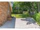 A fenced backyard with grass and mature trees provides privacy at 4077 Phils Ct, Tucker, GA 30084