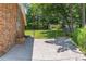 A brick house with a chain link fence and mature trees at 4077 Phils Ct, Tucker, GA 30084