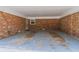 Carport with brick wall, electrical and painted floor at 4077 Phils Ct, Tucker, GA 30084