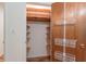 Organized walk-in closet featuring built-in shelves and wire basket storage solutions at 4077 Phils Ct, Tucker, GA 30084