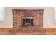 A brick fireplace in a traditionally styled living room at 4077 Phils Ct, Tucker, GA 30084